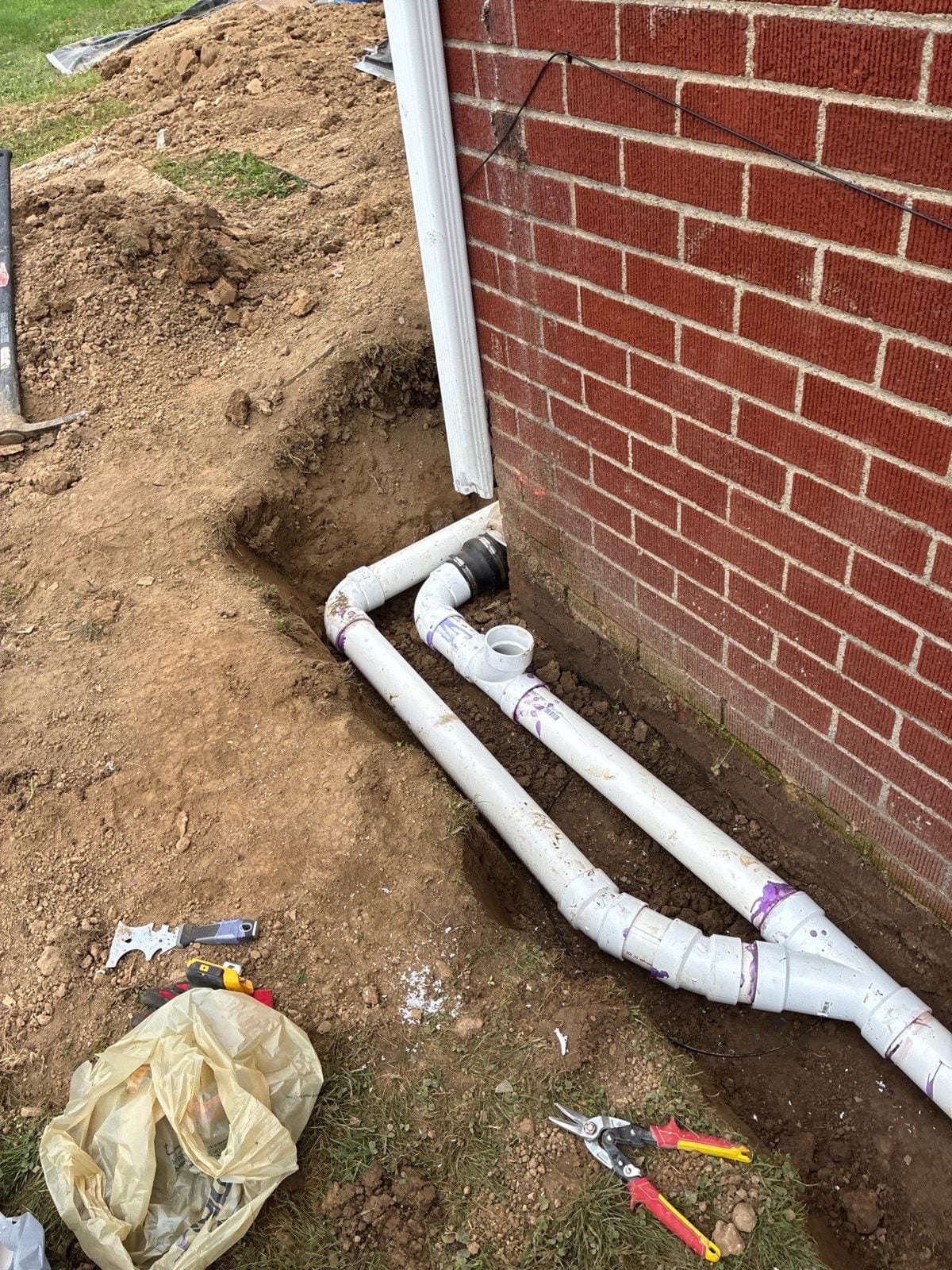 Exterior drainage piping installed to move water away from the foundation in Leechburg, PA