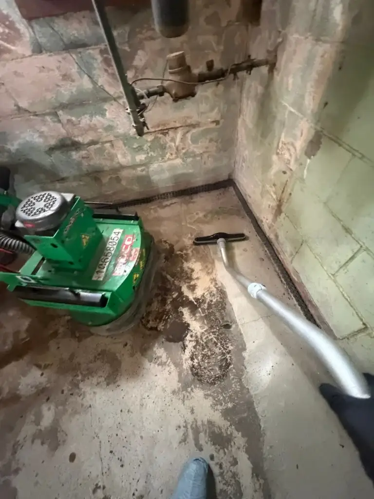 Floor grinder removing old flooring adhesive in Leechburg, PA