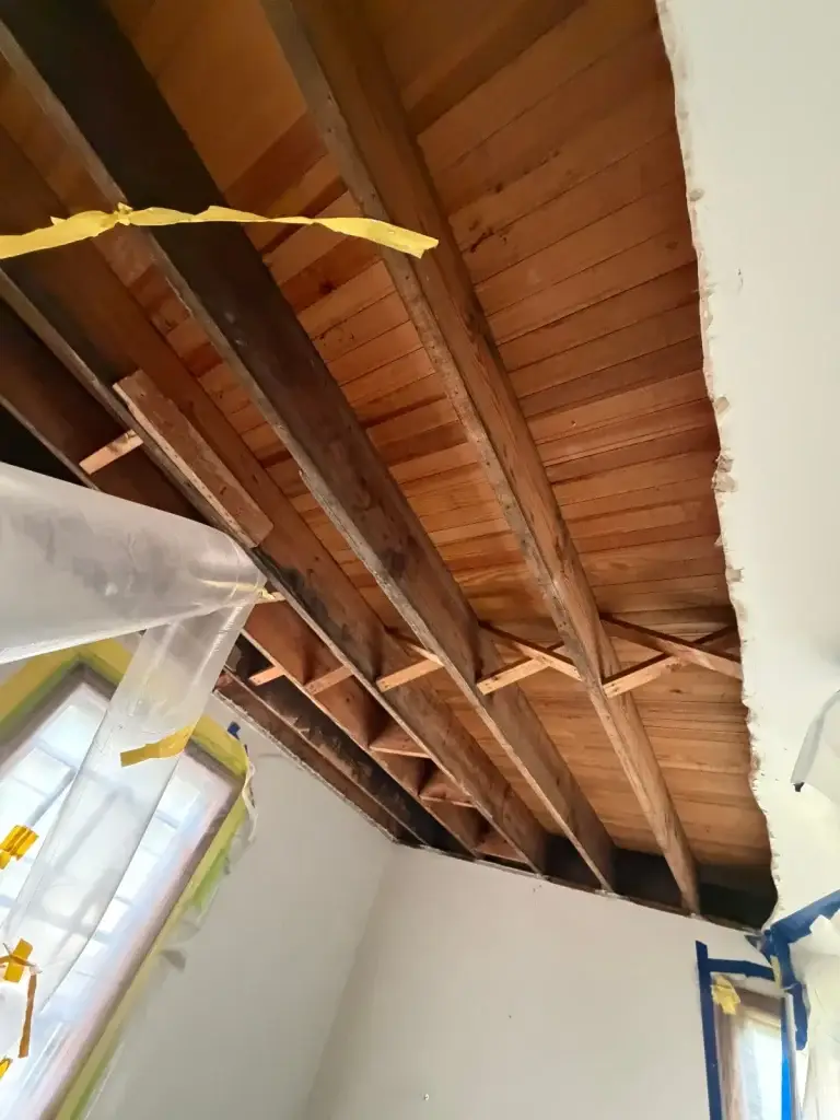 Wood plank ceiling removed to reach hidden damage in New Kensington, PA