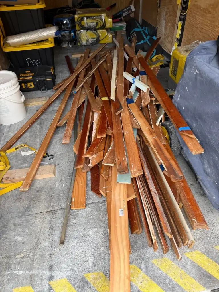 Old trim and lumber stacked for removal in Leechburg, PA