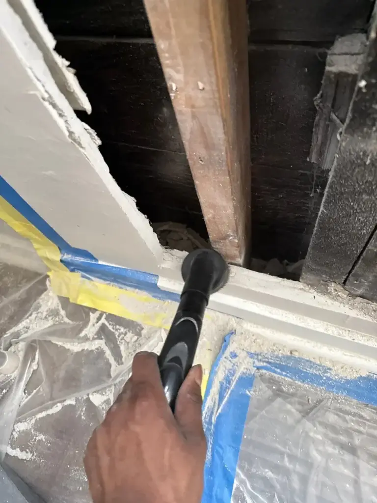 HEPA vacuuming mold from exposed joists in Pittsburgh, PA