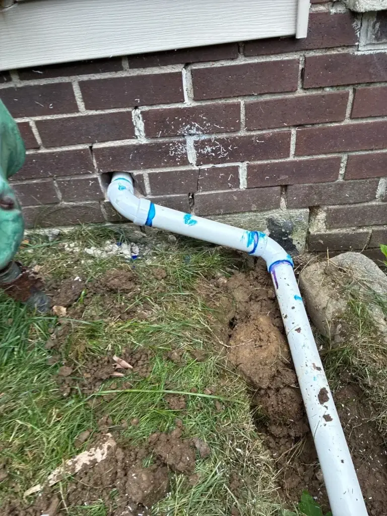 Downspout extension routed away from the foundation in Baden, PA