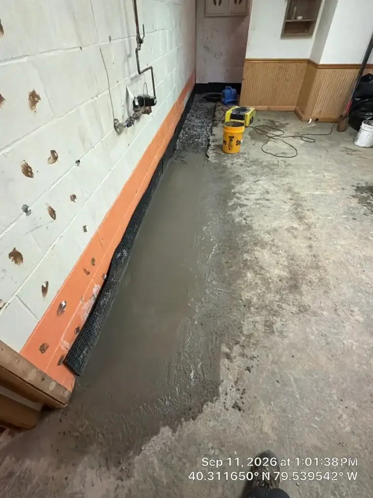 Fresh concrete poured over the new interior drain in Greensburg, PA