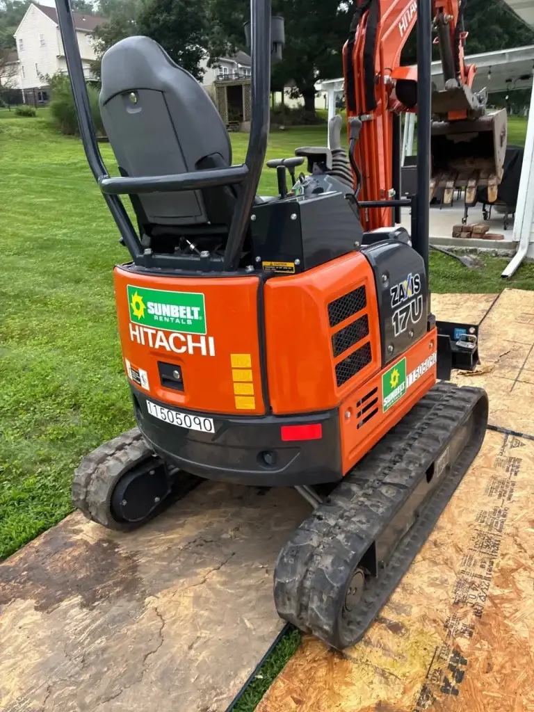 Excavating along the foundation for exterior waterproofing in Leechburg, PA