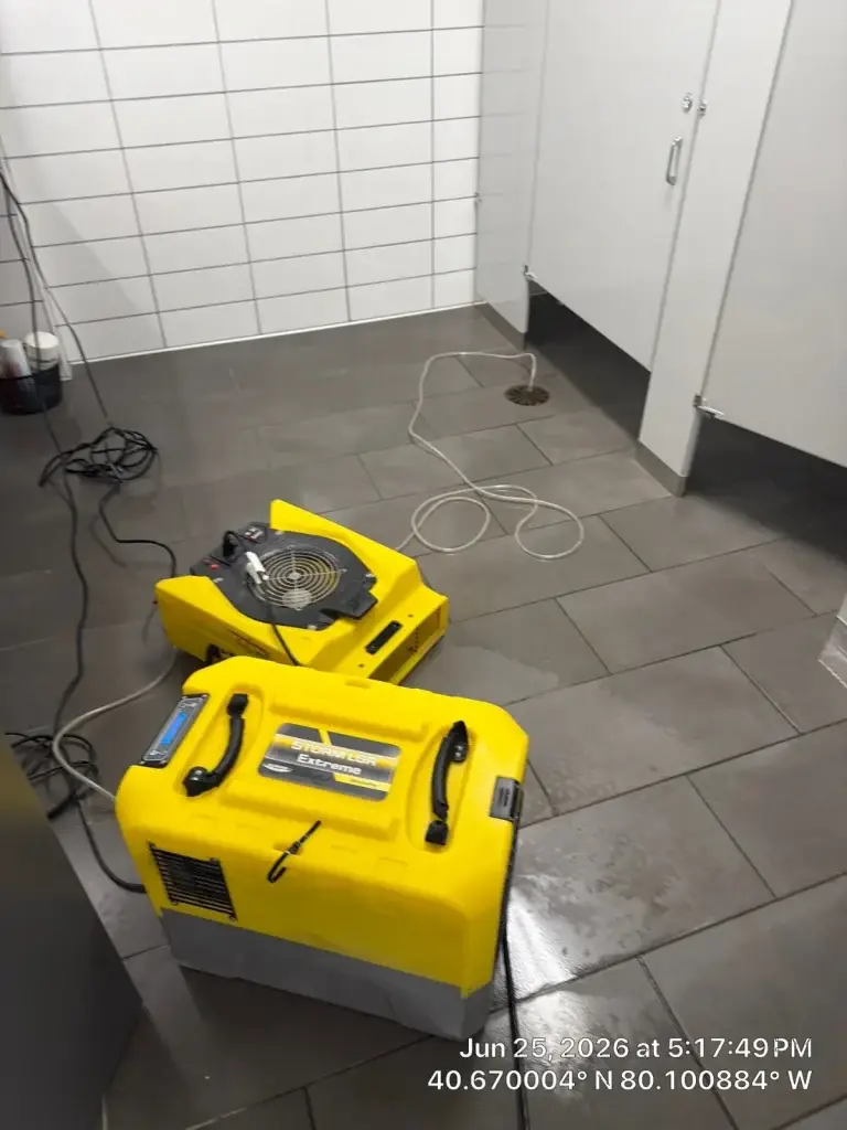 Air movers drying commercial carpet tile in Warrendale, PA